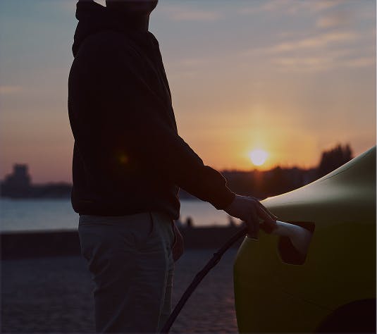 Person charging a car
