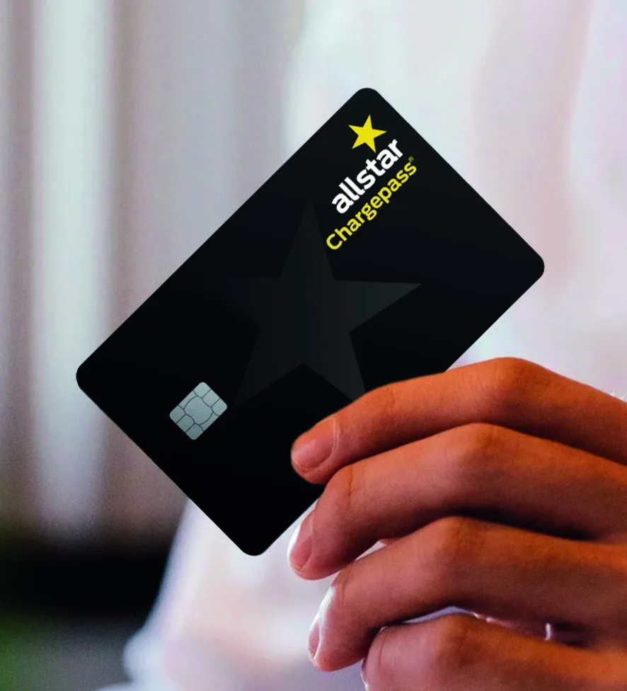 A hand holding an Allstar chargepass card